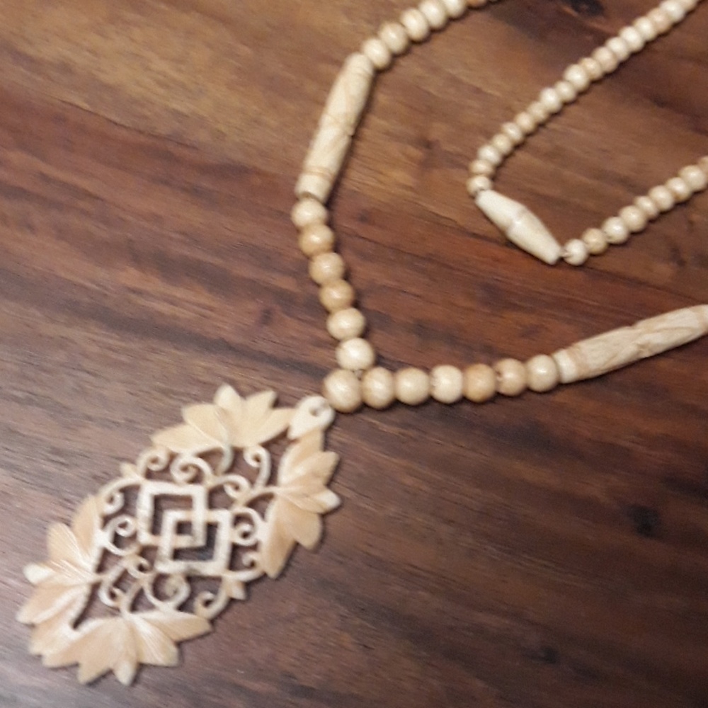 Vintage 1980s carved bone boho girl necklace